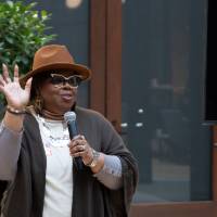 Speaker with hand raised